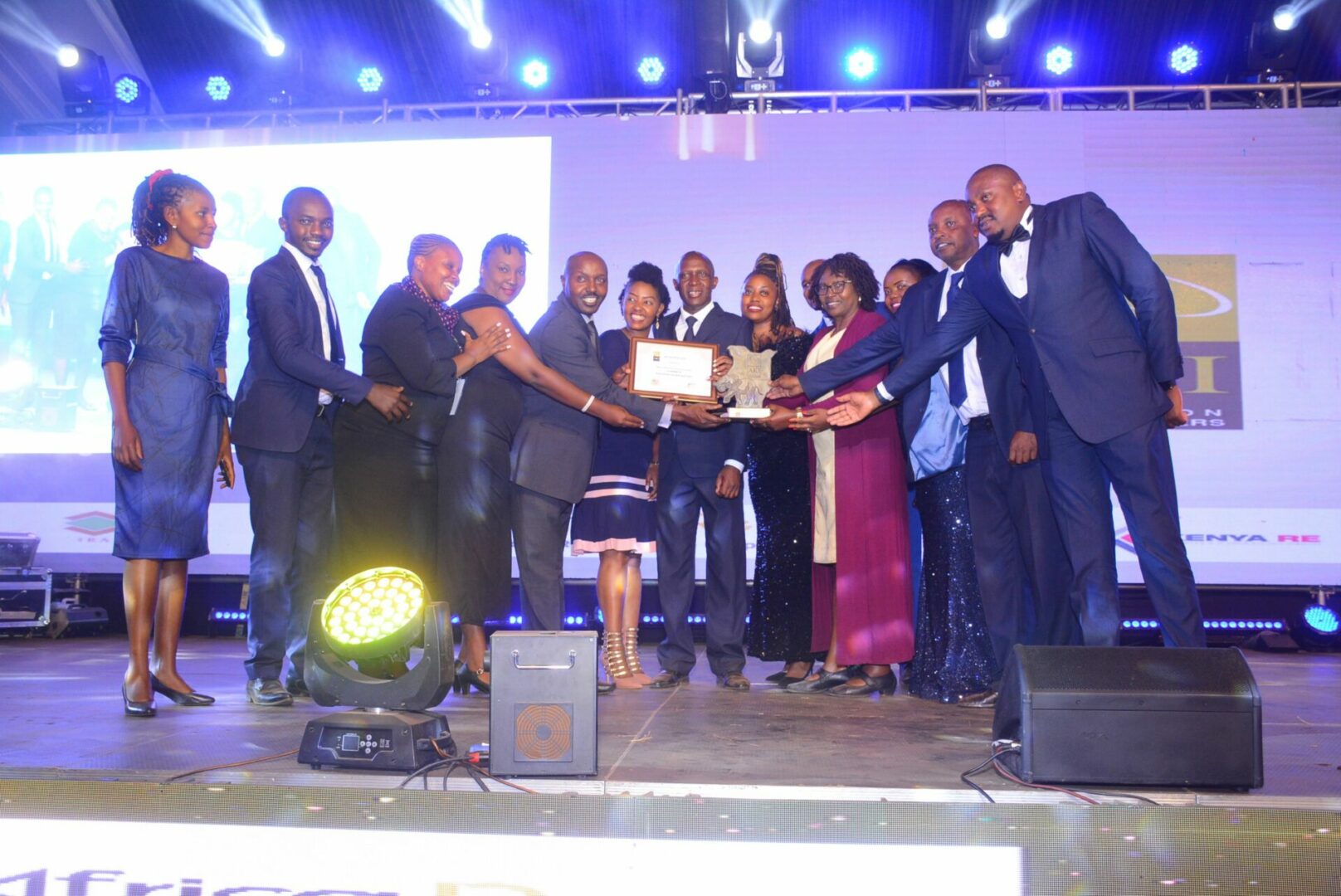 Kenya Orient Life Assurance Principal Officer Jackson Muli (5th L) & his team receive the first runners-up awards in Group Life Best Loss Ratio during the AKI Awards 2022 - Bizna Kenya (Picture Courtesy)