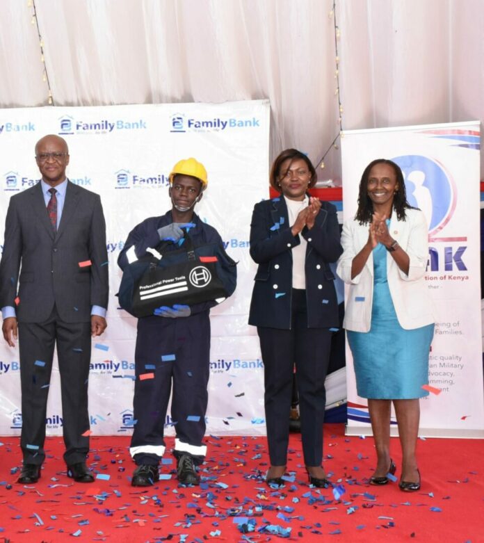 Joseph Okembe, the top performer of the technical and vocational training program by The Family Group Foundation and Military Wives Association of Kenya (MWAK), joins Chief of Kenya Defence Forces Gen. Francis Ogolla, Family Bank CEO Rebecca Mbithi & MWAK Chair Aileen Ogolla (R) during the graduation of 51 dependents of KDF service men & women - Bizna Kenya I Picture courtesy.