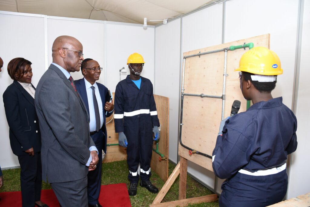 Deborah Kerebi & Kelvin Kipruto demonstrate their plumbing skills to Chief of Kenya Defence Forces Gen. Francis Ogolla, Family Bank Chair Dr. Wilfred Kiboro & CEO Rebecca Mbithi during the graduation of 51 dependents of KDF service men & women from technical and vocational training program by The Family Group Foundation and Military Wives Association of Kenya - Bizna Kenya I Picture courtesy