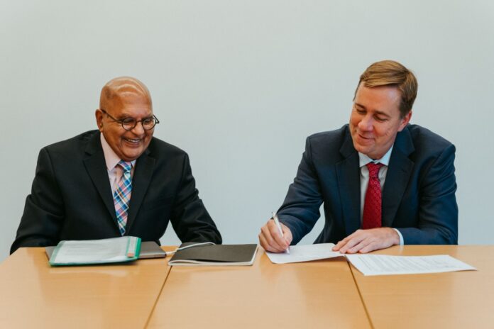 Aga Khan University's Brain and Mind Institute Director Prof Zul Merali and Davos Alzheimer's Collaborative CEO Drew Holzapfel at the partnership signing - Bizna Kenya