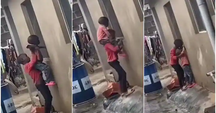 Little brothers melt hearts by carrying each other to watch neighbour’s TV