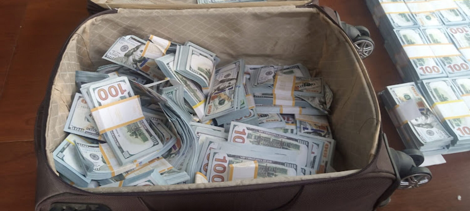 Former MP caught with bags full of fake US Dollars, pulls gun on detectives