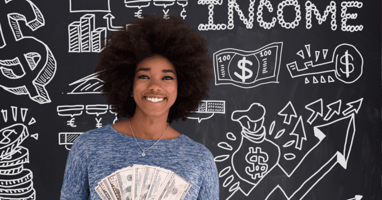 Black woman smiling with dollars in her hands