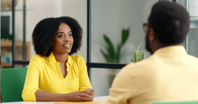 Man and woman in an interview setup.