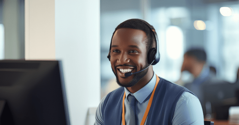 large-portrait-of-a-handsome-african-man-customer-service-operator-call-center-worker-talking-through-headset-with-customer-in-modern-office