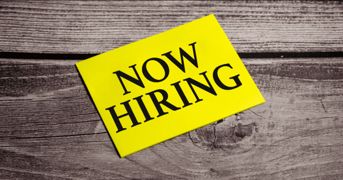 In the yellow sticker the text concept word Now Hiring Free Photo