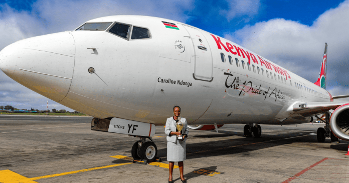 Caroline Ndonga is standing near the Boeing 737.