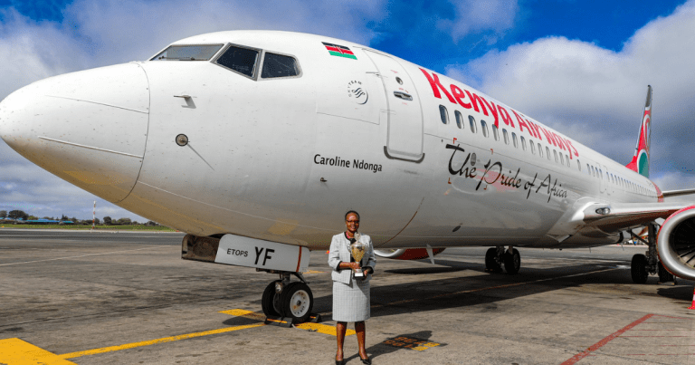 Caroline Ndonga is standing near the Boeing 737.