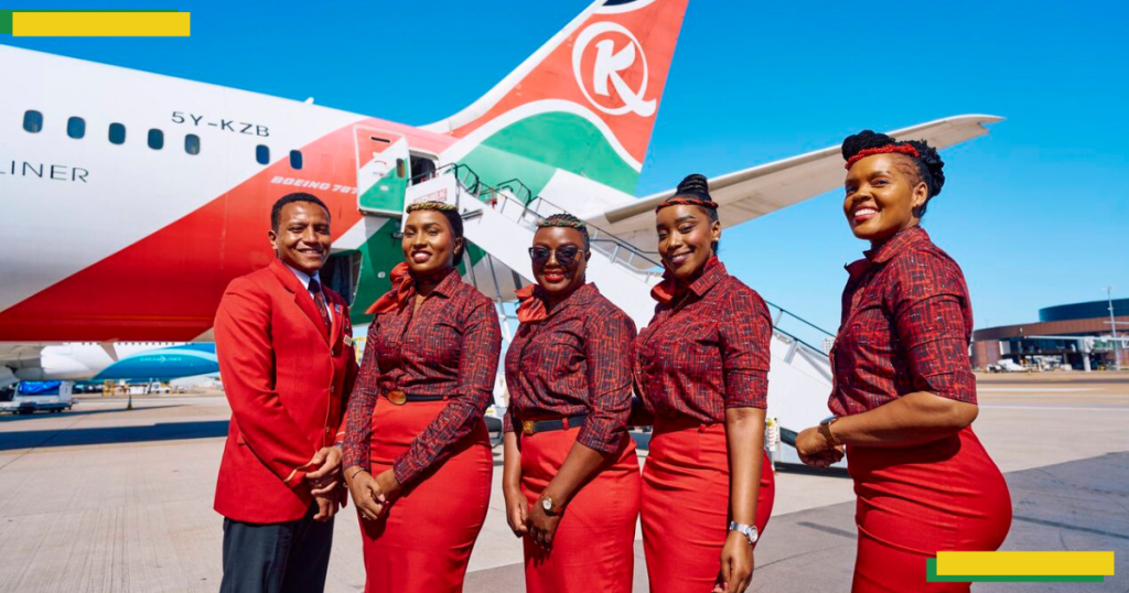 KQ Staff pose for a phot near an aircraft