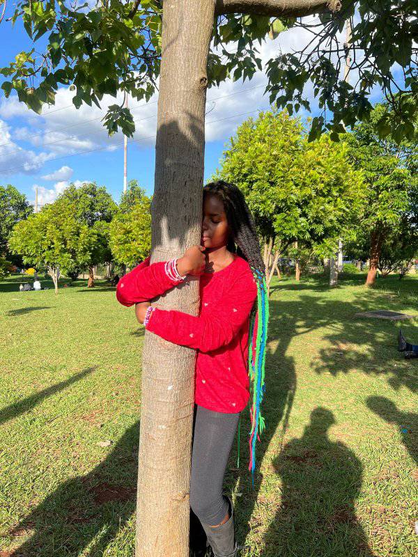 Truphena Muthoni: Kenya's tree-hugging champion sets sights on 72-hour marathon 2 Truphena Muthoni hugs tree