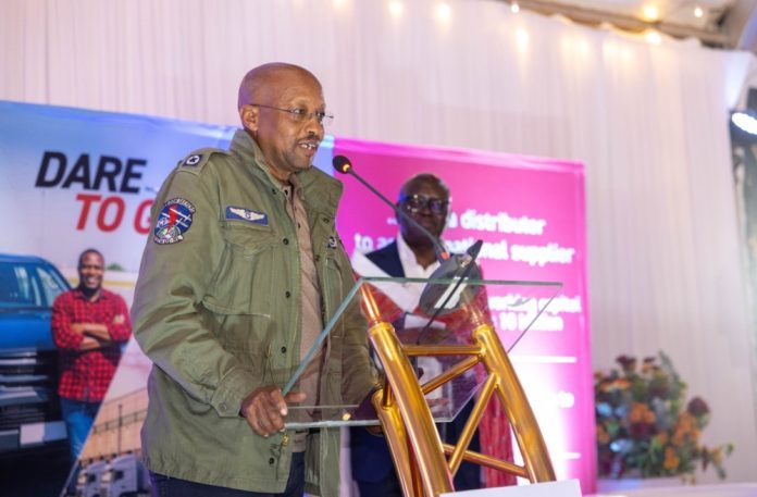 Narok-County-Executive-Committee-Member-for-Finance-David-Ole-Muntet-speaks-at-a-dinner-with-Equity-Bank